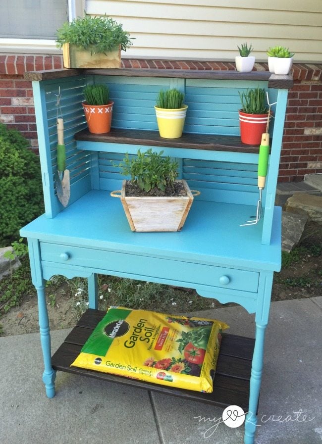 Repurposed Shutters and desk into potting bench. This potting bench could easily be used indoors for kitchen organization. #MyLove2Create #MyRepurposedLife #repurposed #shutters #desk #pottingbench via @repurposedlife